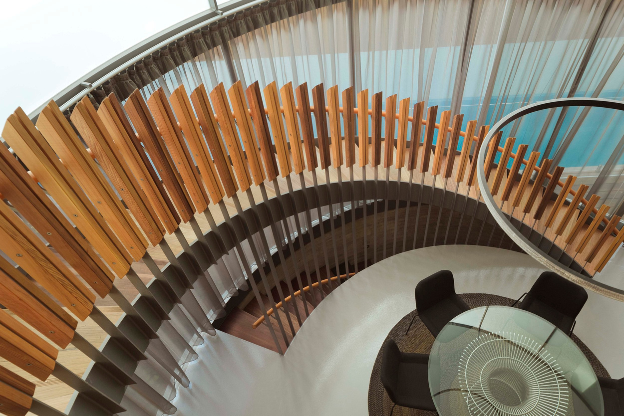 a spiral staircase made of wood and glass